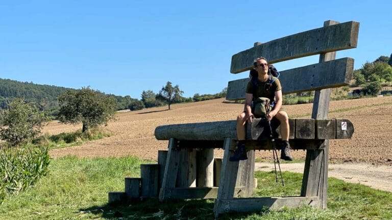 DeWandelaar sitting on the Sitzbank XXL by Heimersheim on the AhrSteig long-distance trail in the Ahr Valley