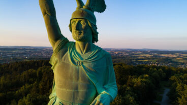 Drone view of the Hermannsdenkmal on the Hermannsweg with Teutoburg Forest in the background