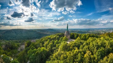 A panoramic aerial view of the Hermannsdenkmal looking out over the Teutoburg Forest